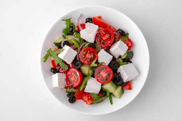 Greek salad top. Dishes for delivery, online store. Isolated on a white background.