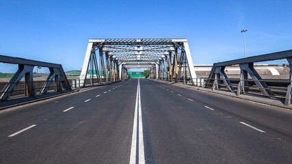 Dual Road Steel Iron Bridge New Asphalt Middle Perspective with blue sky.
