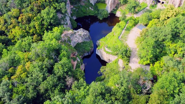 Flooded ancient stone quarry in Hungary near Sarospatak: Megyer-hegyi tengerszem. Small lake at the top of a hill. View from the top. Fantastic nature attraction in Tokaj area. 