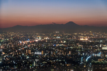 Mount Fuji looking out over Tokyo after sunset.