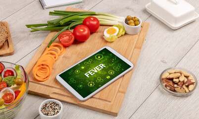 Healthy Tablet Pc compostion with FEVER inscription, immune system boost concept