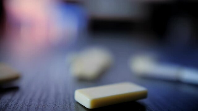 Domino Falling on a Table