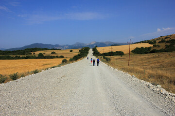 Azerbaijan. Tourists walking along the road.
