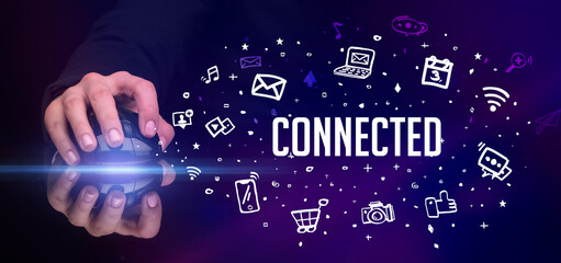 hand holding wireless peripheral with CONNECTED inscription, social media concept