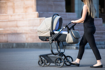 woman and stroller in street