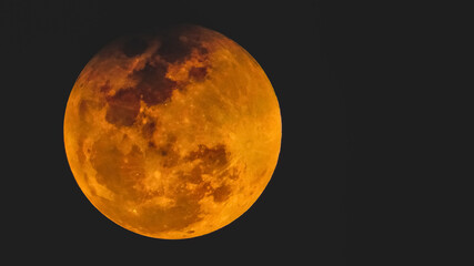 orange moon day , the natural satellite in dark space , outer space full moon day , The Moon is an astronomical body in earths orbit , blood red moon, dwarf planet