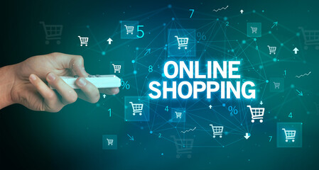 hand holding wireless peripheral with ONLINE SHOPPING inscription, online shopping concept