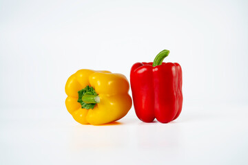 Two of Bell pepper red and yellow isolated on white background