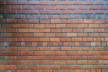 Red brick wall wet from rain.