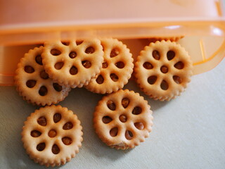 Shortbread cookies in a plastic container on the table. vertical view from above