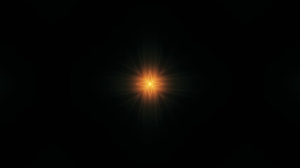 Beautiful lens flare with rays on a black background.