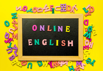 Word Learning english made with wooden letters over the wooden board