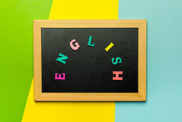 Word Learning english made with wooden letters over the wooden board