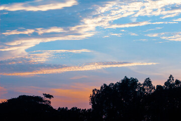 Beautiful blue orange sky with clouds background