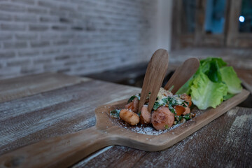 Mix Sausage, cheese, vegetables on wooden plate,