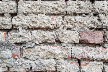 a brick wall on an old ruined house