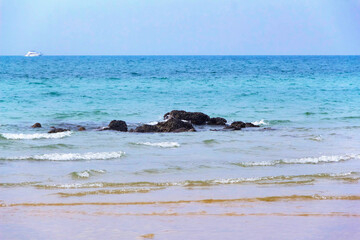 sea wave is breaking on the shore, tide, beach