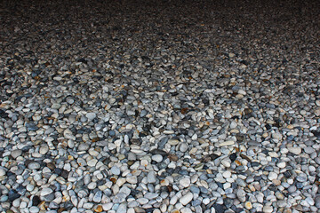 White, grey and dark brown sea pebbles