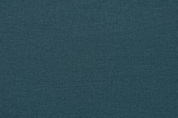 Dark green background with a textured surface, fabric.