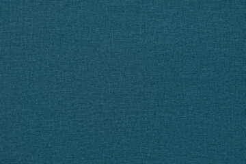 Green-blue background with a textured surface, fabric.