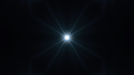 Beautiful lens flare with rays on a black background.
