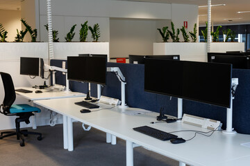 Empty work stations in a modern open space office