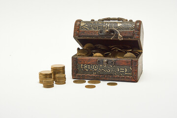 Chest with coins on a white background.