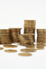 Stacks of coins on a white background.