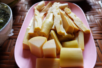 Boiled bamboo shoots on pink dish for vegetable eaten with chili paste or pepper sauce is tradition Thai food