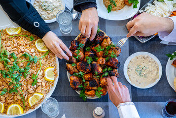 happy muslim family eating togther