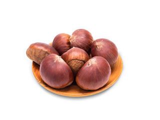 Chestnut in wood plate isolated on white background with clipping path.