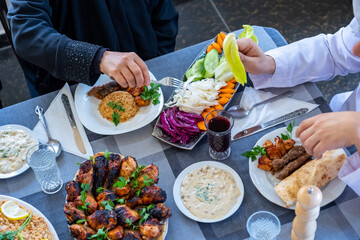happy muslim family eating togther