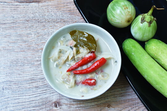 herb soybean sauce with pickled fish and Budu Thai southern sauce in coconut milk sauce served couple boiled vegetable on plate