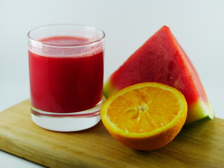 glass of juice and fruits