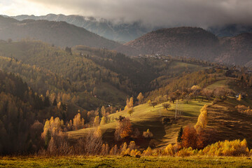 Incredible valley picture with clouds and all colours of nature. Green valley and colorful trees.