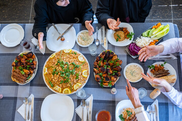 happy muslim family eating togther
