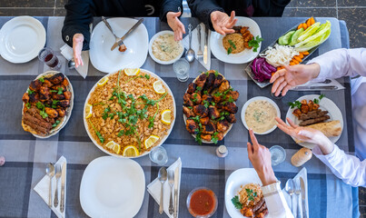 happy muslim family eating togther