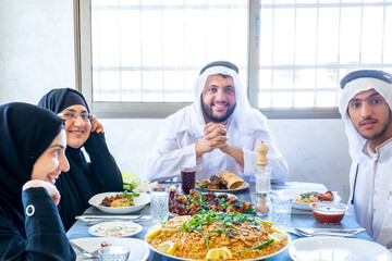Happy arabic muslim family enjoying the food togther in ramadan