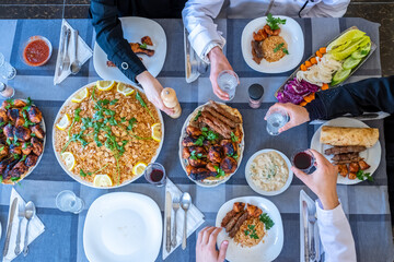 happy muslim family eating togther