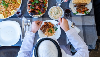 Happy arabic muslim family enjoying the food togther in ramadan