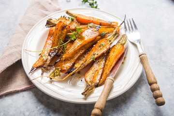 Still life of roasted baby carrots with a herb and honey glaze