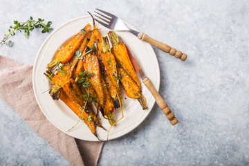 Still life of roasted baby carrots with a herb and honey glaze