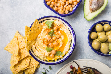 Directly above shot of Hummus or humus In bowl on table. Vegan plant based food