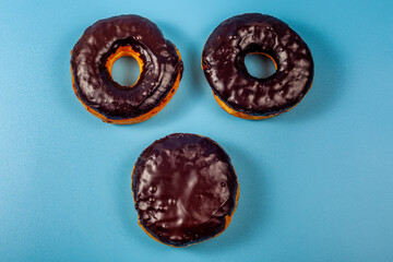 Three Donuts on blue backgrounds