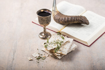 Passover, the Feast of Unleavened Bread, matzah  and  Kosher red wine glasses shofar (horn) with...