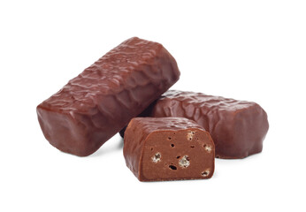 Chocolate candies and candy bar in half isolated on white background.