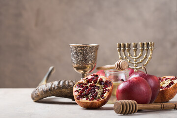 Rosh hashanah - jewish New Year holiday concept. Traditional symbols: Honey jar and fresh apples...
