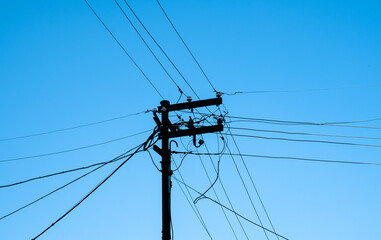 cable clutter on electric pole and street lamp