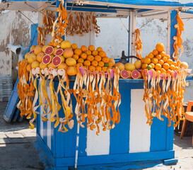 peeled oranges in a market stall
