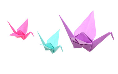 three origami cranes on white background